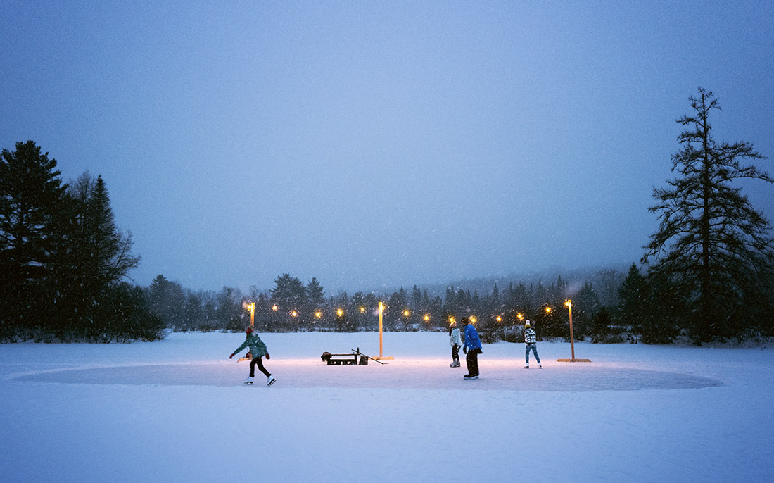 People ice skating on a lake