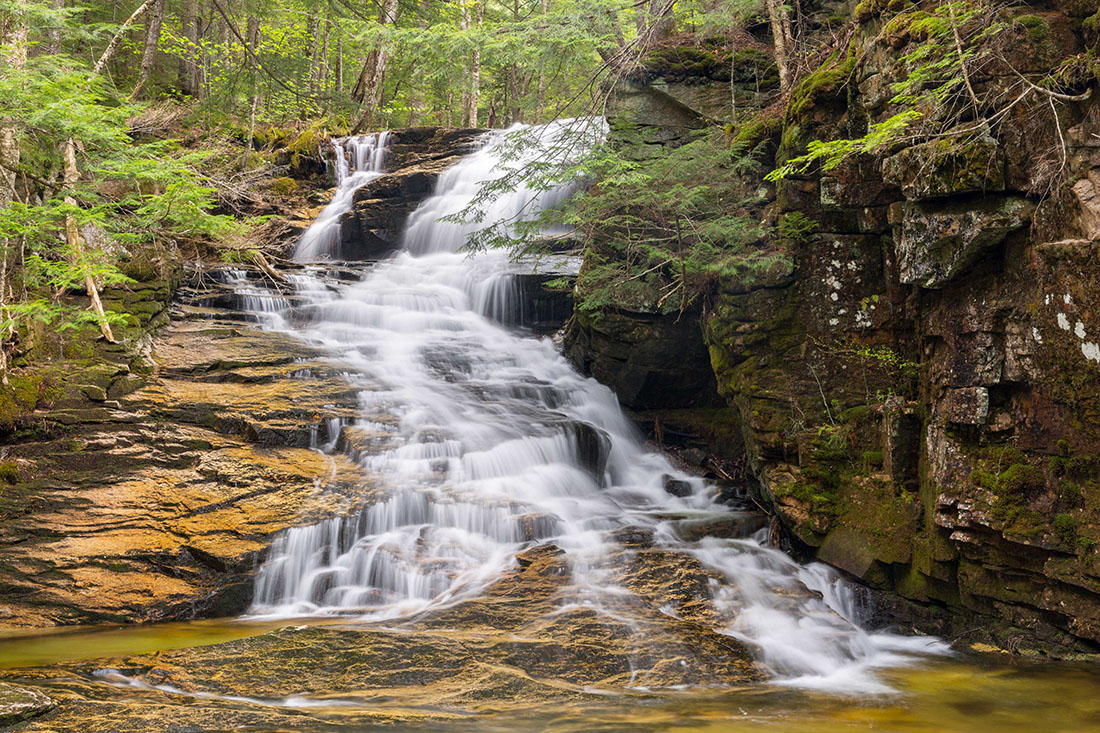 a large waterfall in the white mountains