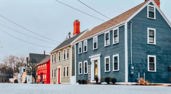 a group of colored historic houses