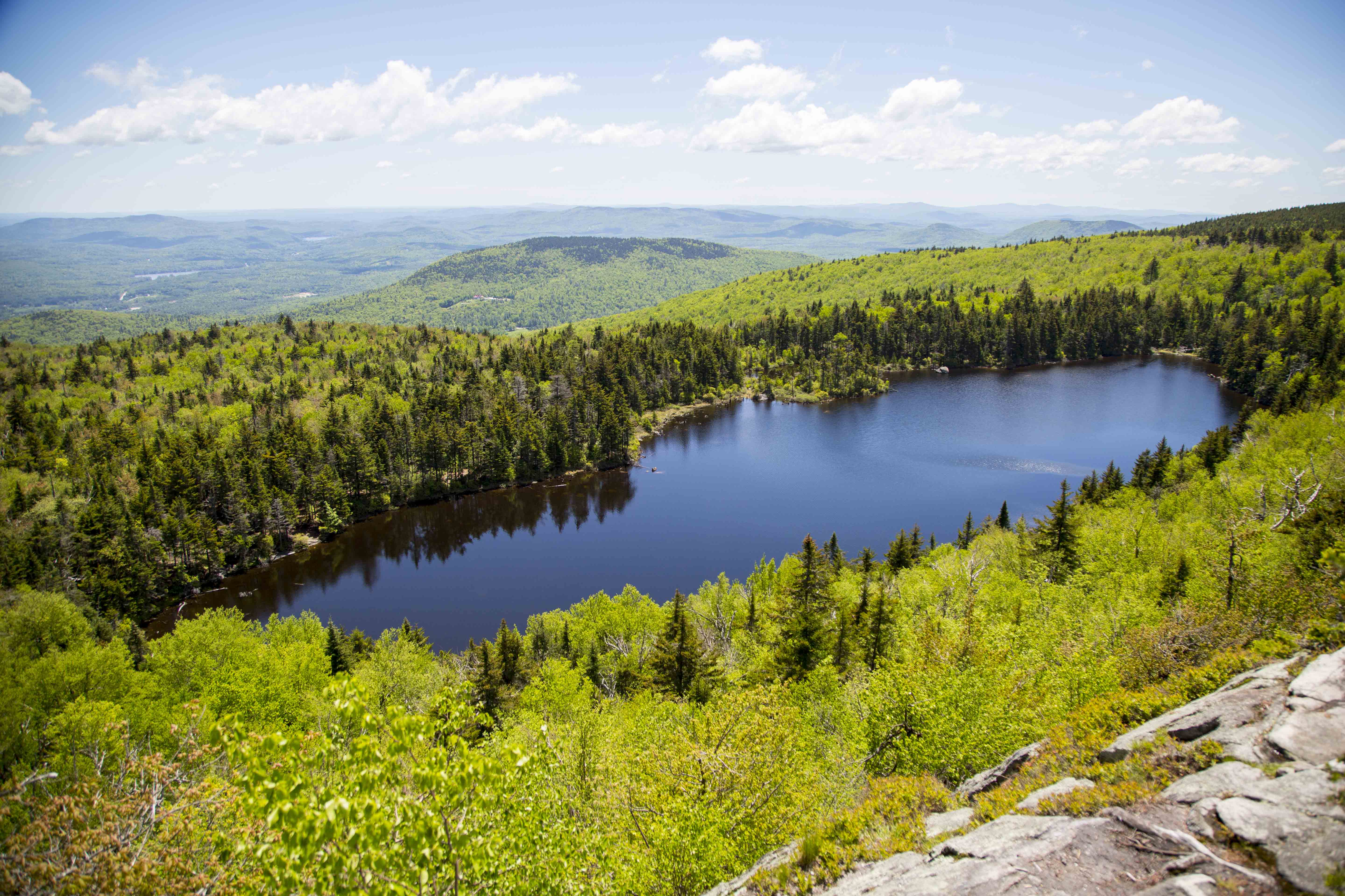 An aerial view of a lake in the mountains