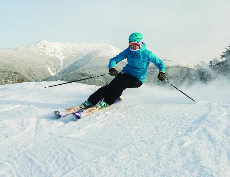 person skiing down a mountain