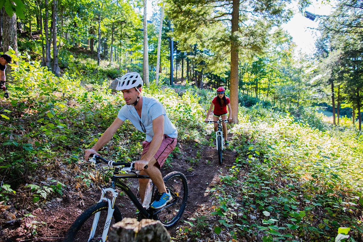 people mountain biking