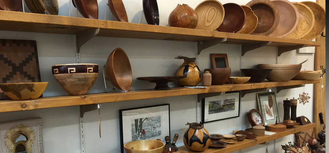 hand made pottery sitting on a shelf