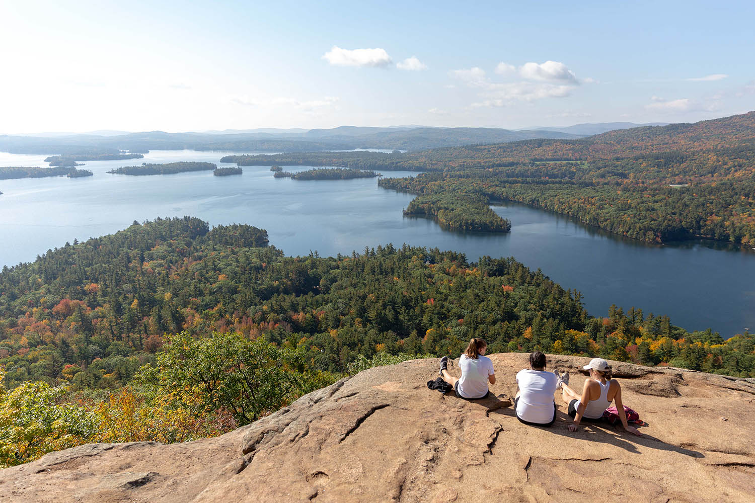 aerial view of people sitting at the top of the lakes region