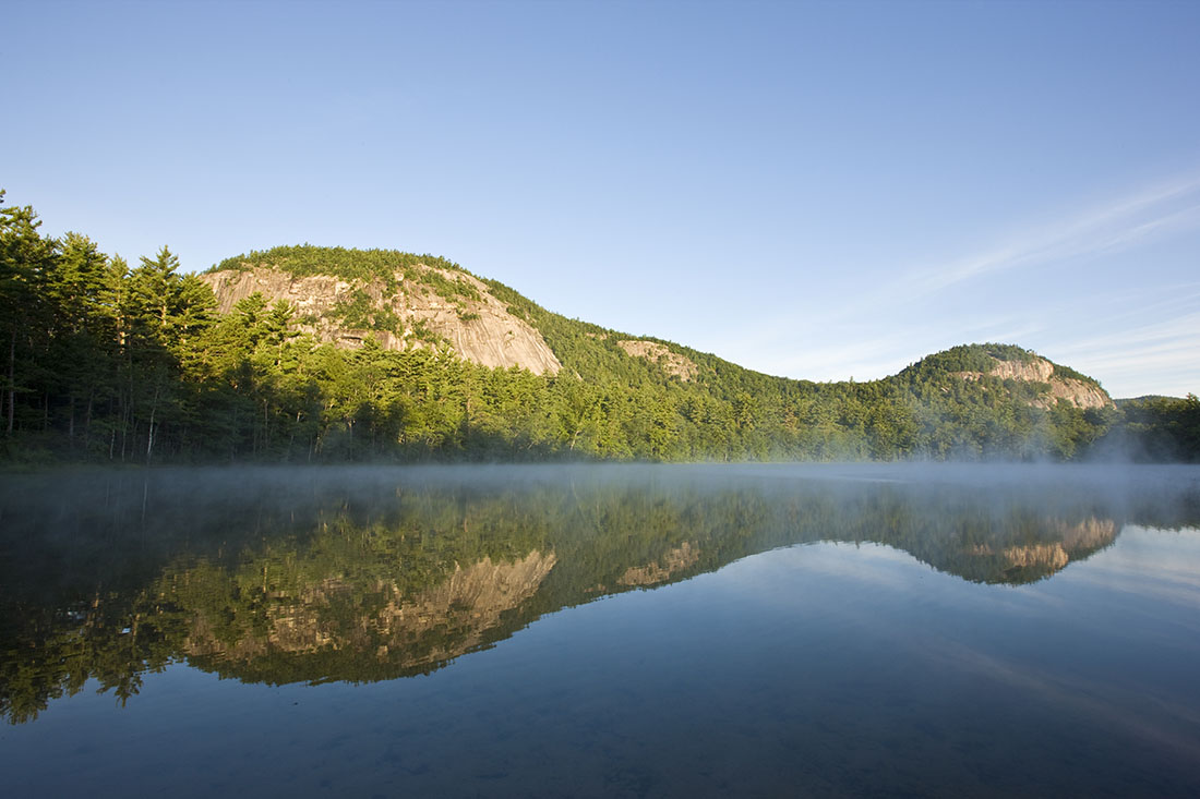 Image of mountain reflecting off water