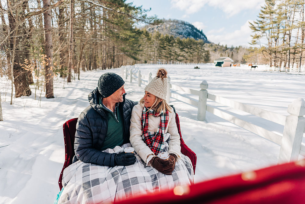 a couple on a winter sleigh ride