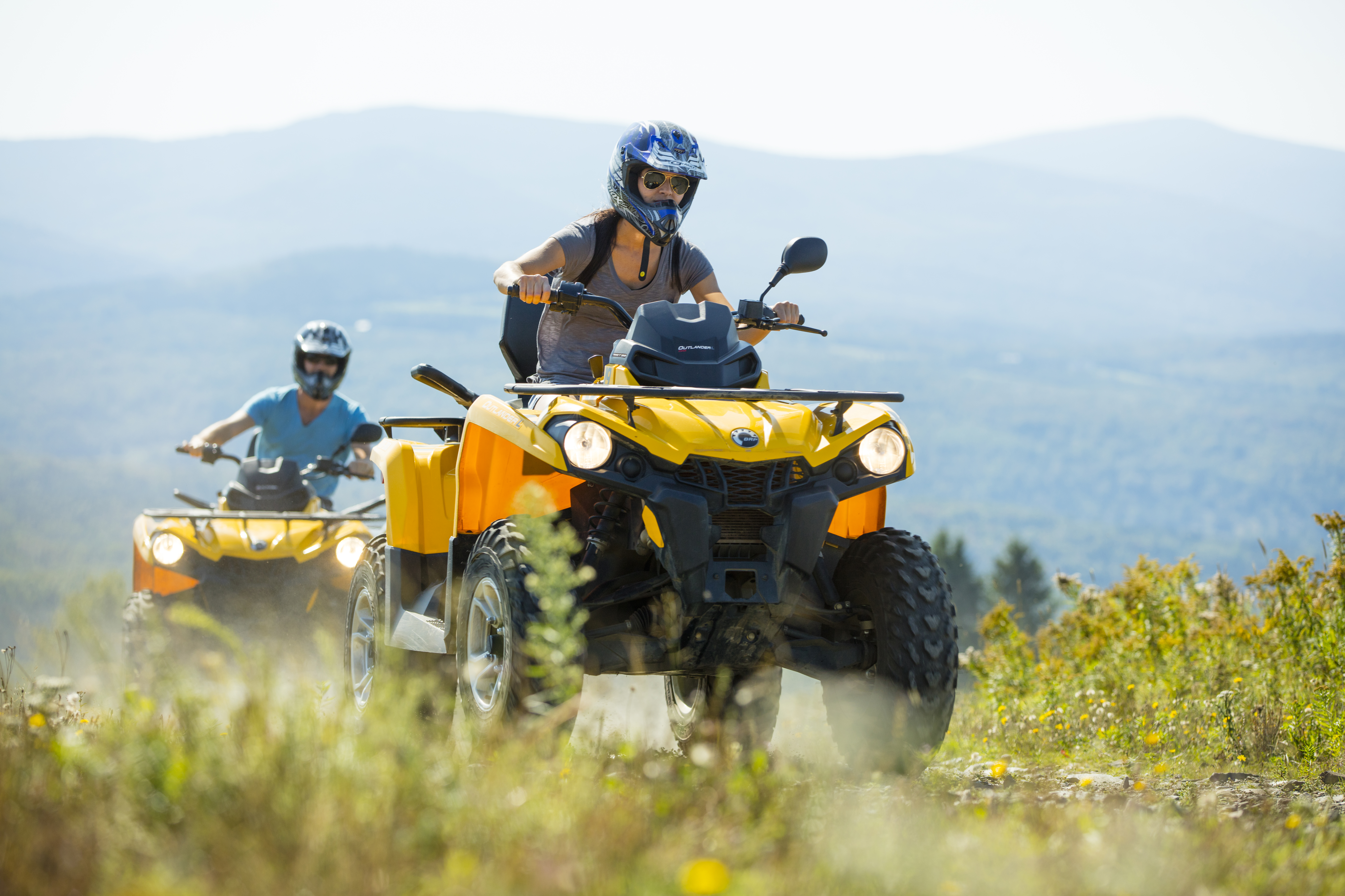 People riding ATV in the mountains