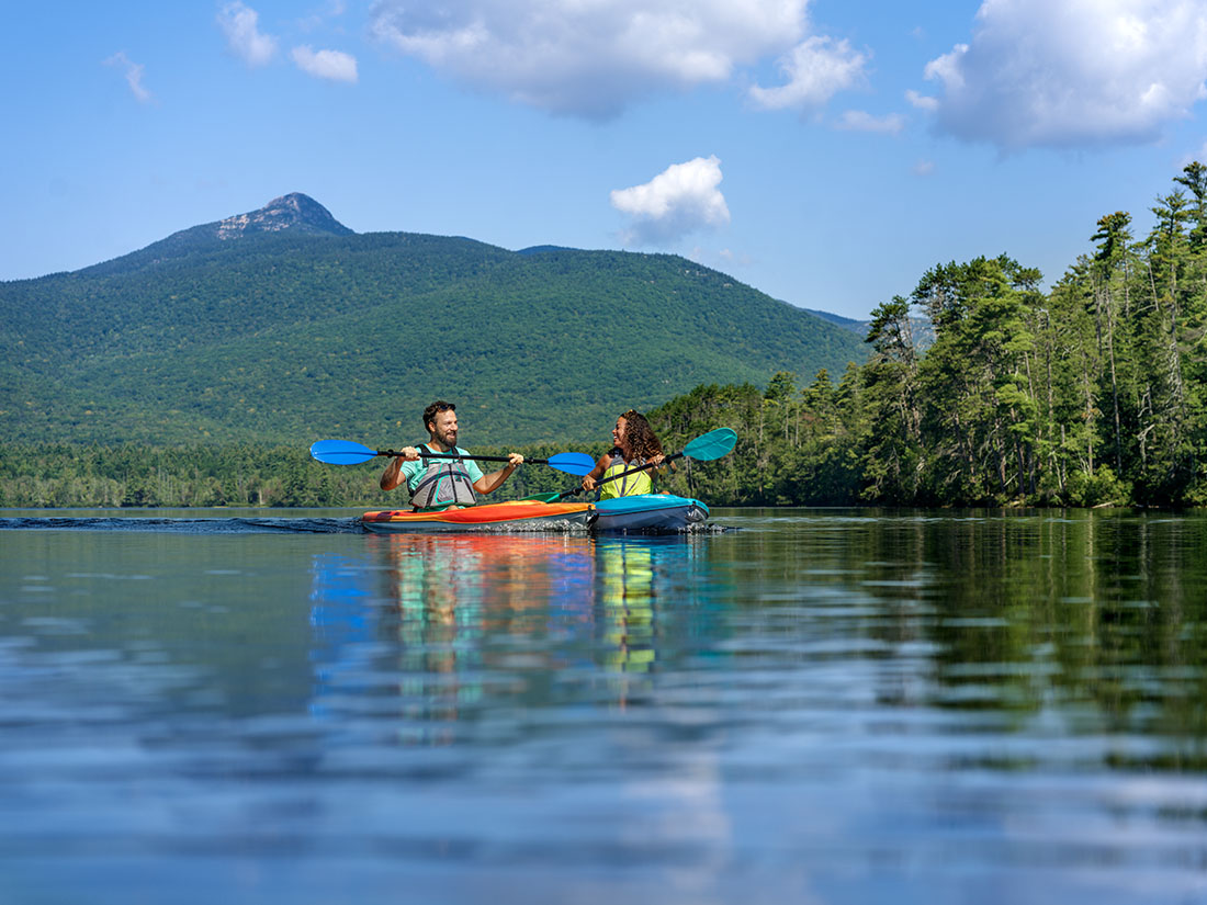 Two people kayaking in NH