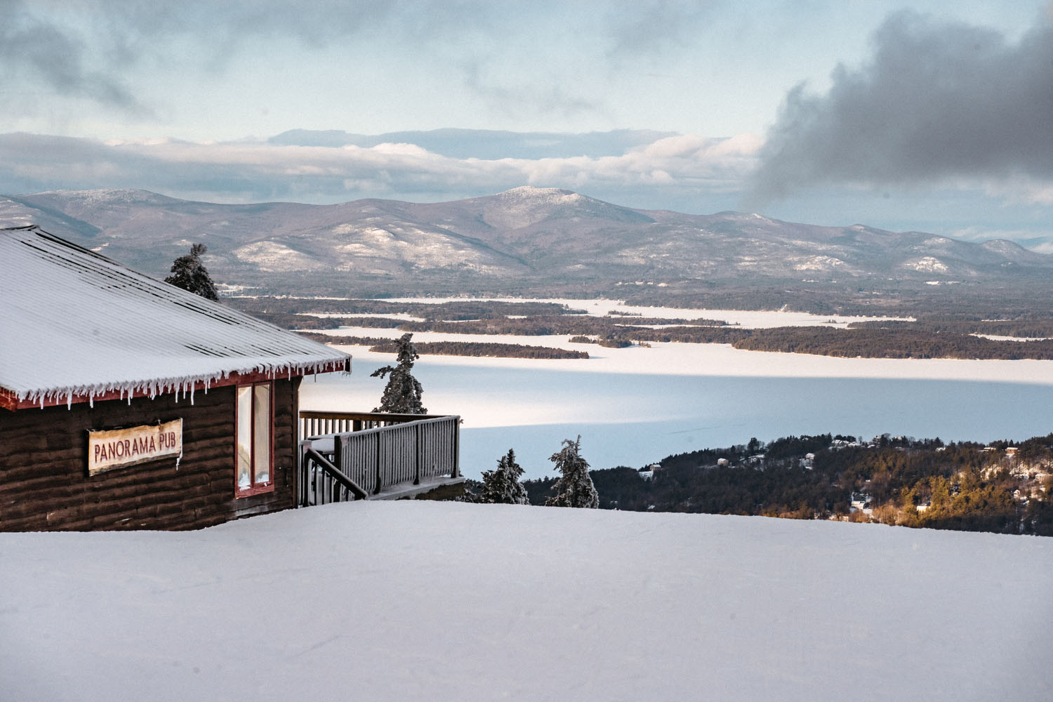 a house overlooking gunstock in the winter