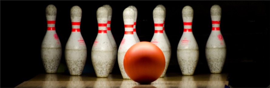 Bowling ball about to hit bowling pins at Yankee Lanes